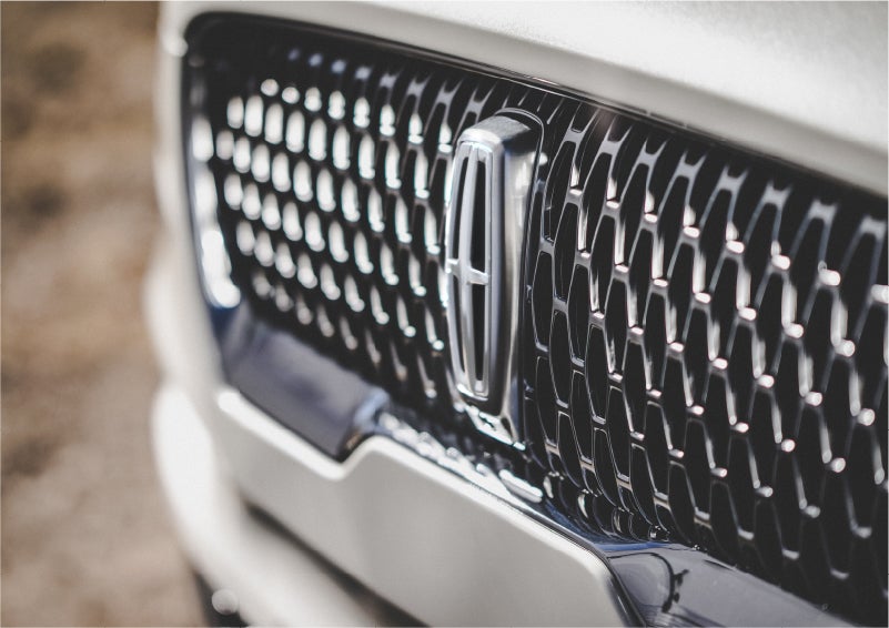 The grille of the 2023 Lincoln Aviator® Reserve model with an eye-catching repeated field of Lincoln Star logo shapes | Lexington Park Ford Lincoln in California MD
