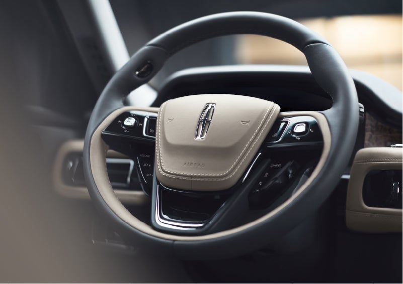 The intuitively placed controls of the steering wheel on a 2023 Lincoln Aviator® SUV | Lexington Park Ford Lincoln in California MD