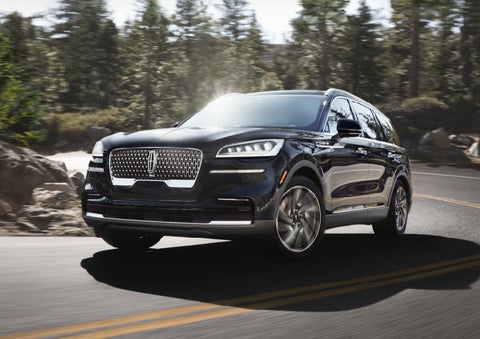 A Lincoln Aviator® SUV is being driven on a winding mountain road | Lexington Park Ford Lincoln in California MD
