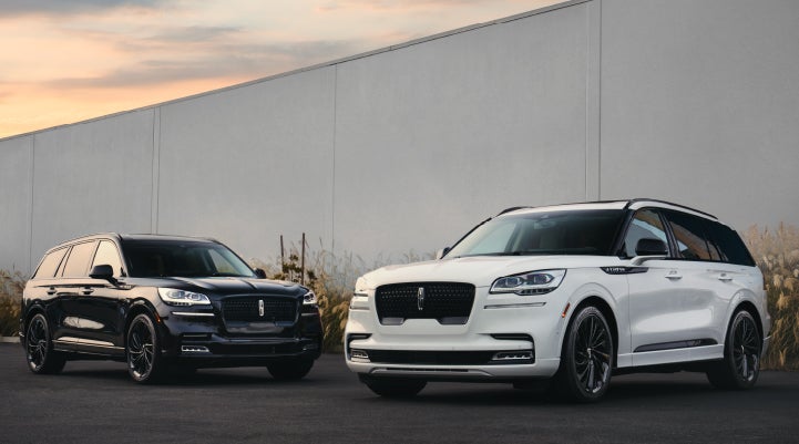 Two Lincoln Aviator® SUVs are shown with the available Jet Appearance Package | Lexington Park Ford Lincoln in California MD