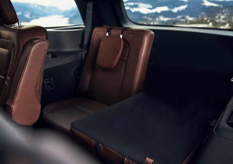 The left rear seat of a 2024 Lincoln Aviator® SUV is shown folded flat for additional cargo space | Lexington Park Ford Lincoln in California MD