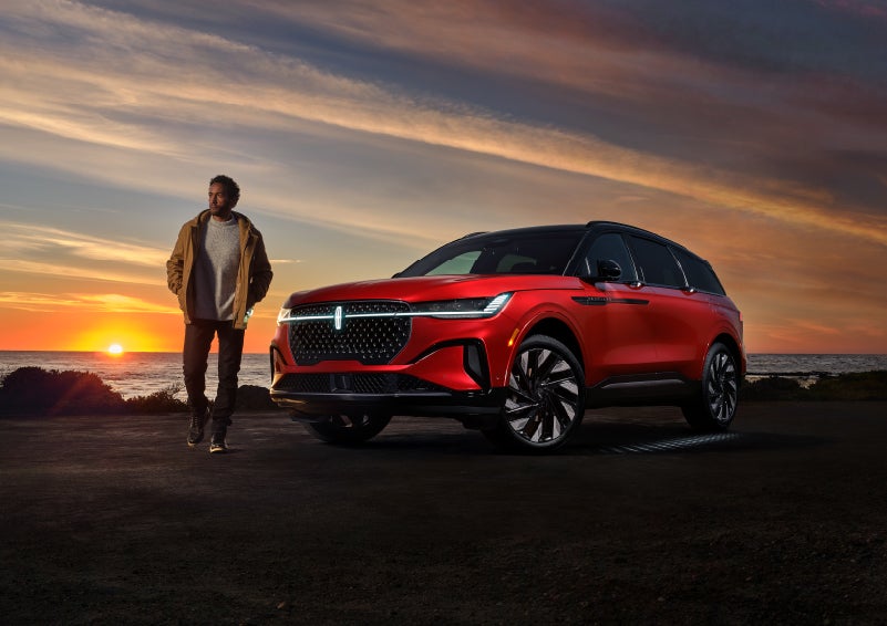 A person is shown next to a 2024 Lincoln Nautilus® SUV as the Lincoln Embrace sequence takes place. | Lexington Park Ford Lincoln in California MD