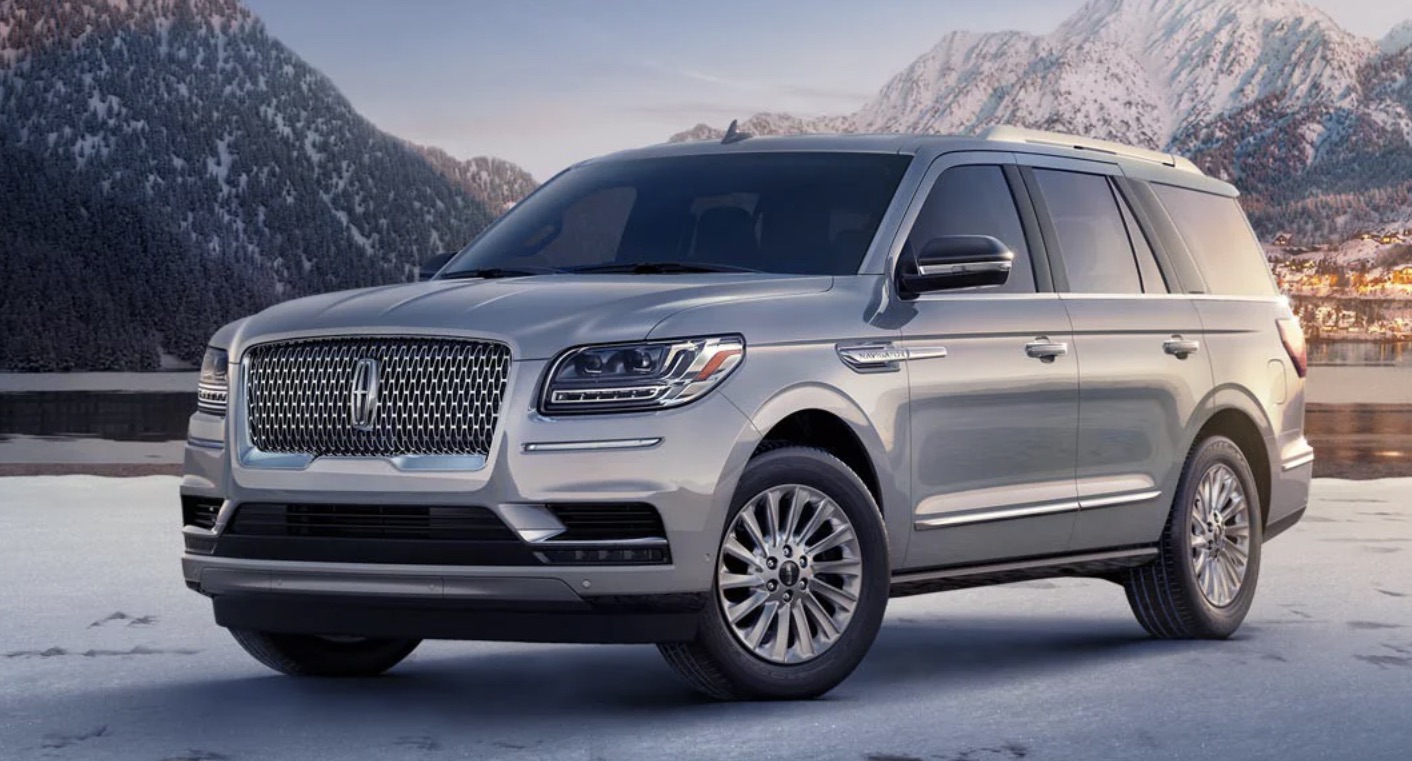 2022 Lincoln Navigator parked on a snowed lot with snow-capped mountains in the background