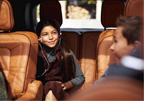 Two young people are comfortably seated in the second and third rows of a Lincoln Aviator® SUV | Lexington Park Ford Lincoln in California MD