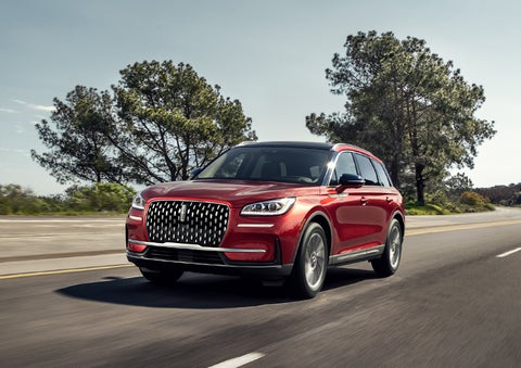 A 2024 Lincoln Corsair® SUV is shown being driven on a country road. | Lexington Park Ford Lincoln in California MD