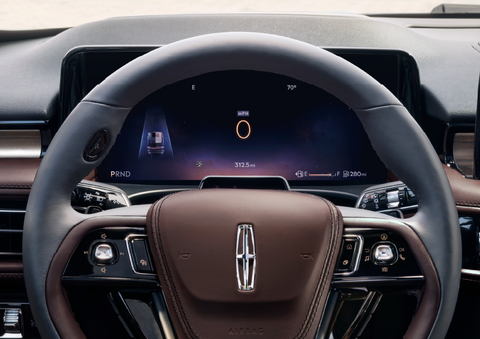 The steering wheel of 2025 Lincoln Aviator® SUV is shown with black and brown accents. | Lexington Park Ford Lincoln in California MD