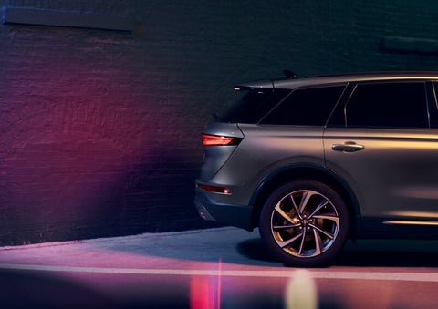 A dramatization of a 2025 Lincoln Corsair® SUV is shown backing up toward a wall. | Lexington Park Ford Lincoln in California MD