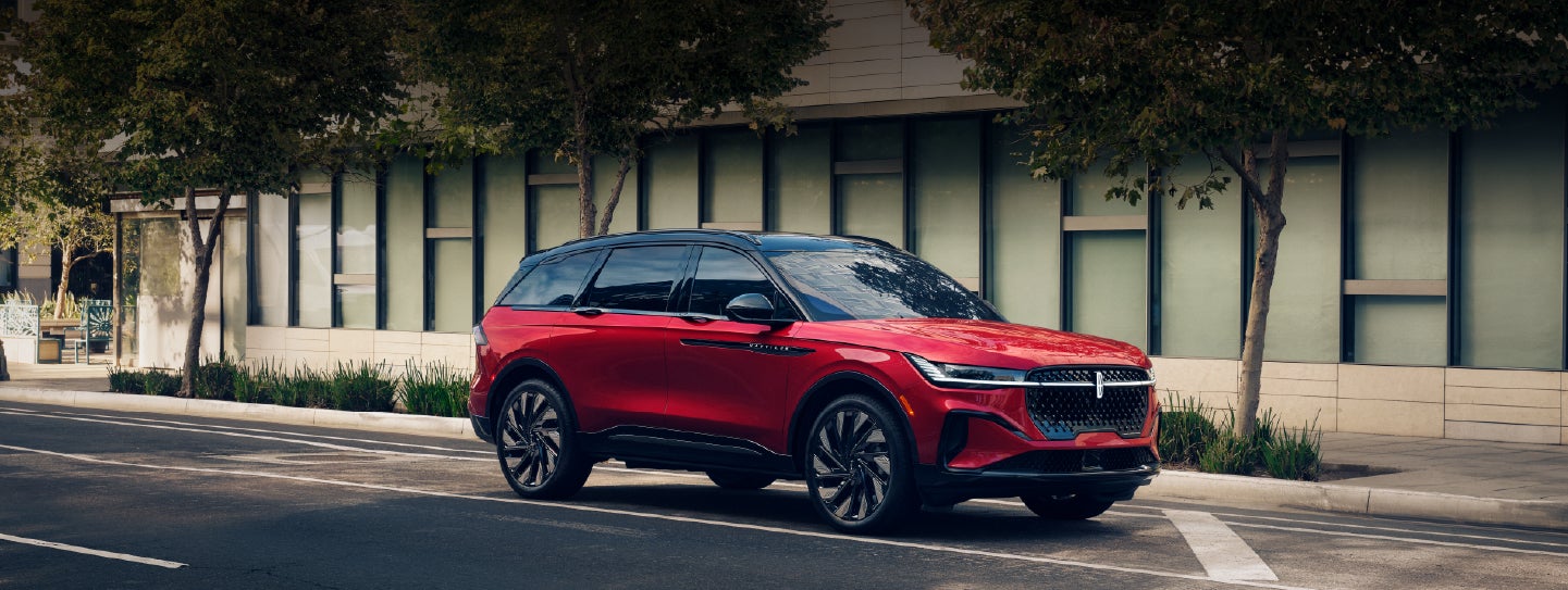 A 2025 Lincoln Nautilus® SUV with an available hybrid powertrain is parked in an urban setting. | Lexington Park Ford Lincoln in California MD