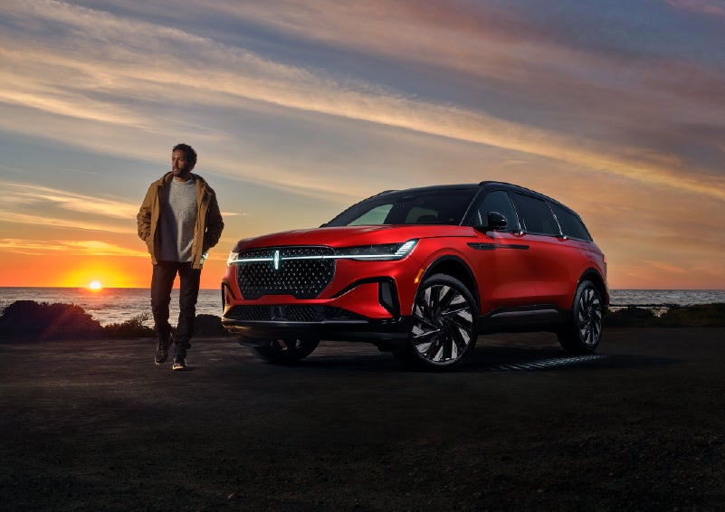 A person is shown next to a 2025 Lincoln Nautilus® SUV as the Lincoln Embrace sequence takes place. | Lexington Park Ford Lincoln in California MD