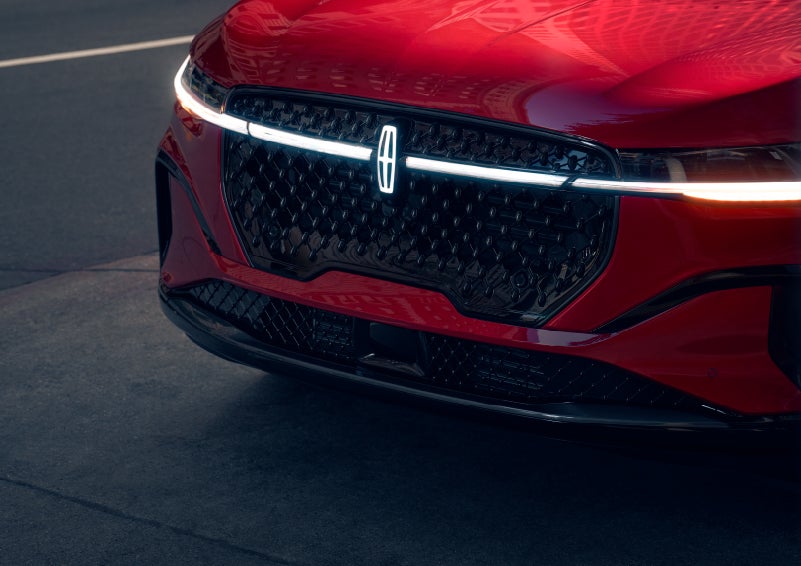 The available front LED light bar and center Lincoln Star logo glow at dusk. | Lexington Park Ford Lincoln in California MD