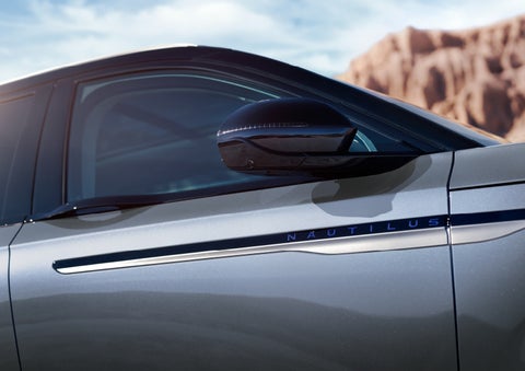 Blue lettering on the side of the vehicle that reads nautilus indicates the available hybrid powertrain. | Lexington Park Ford Lincoln in California MD