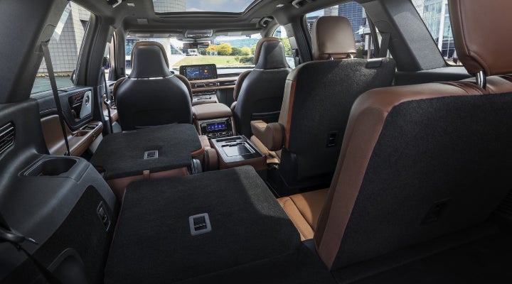 One side of the PowerFold® third-row seat and a second-row seat are folded forward in the 2026 Lincoln Aviator® SUV. | Lexington Park Ford Lincoln in California MD
