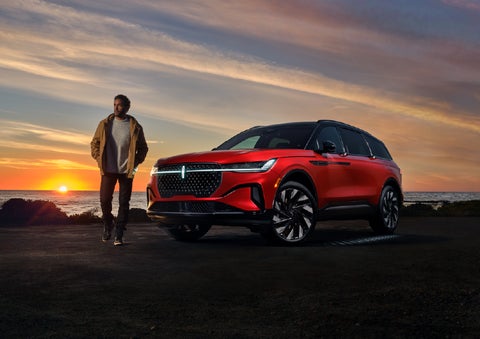 A person is shown next to a 2026 Lincoln Nautilus® SUV as the Lincoln Embrace sequence takes place. | Lexington Park Ford Lincoln in California MD