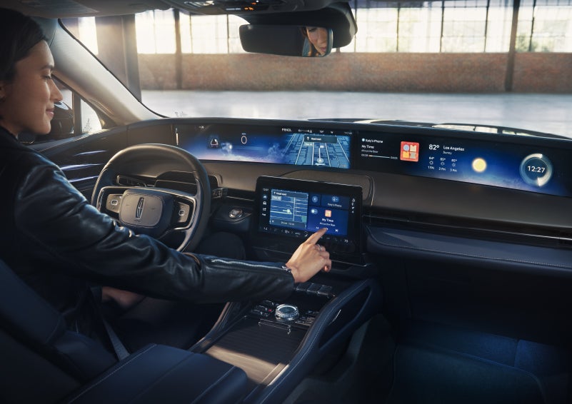 The driver of a 2026 Lincoln Nautilus® SUV interacts with the center touchscreen. | Lexington Park Ford Lincoln in California MD