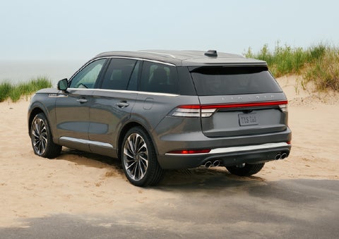 A 2027 Lincoln Aviator® SUV is parked next to sand dunes. | Lexington Park Lincoln in California MD