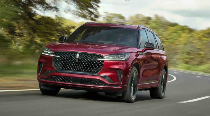 A 2027 Lincoln Aviator® SUV is being driven on a country road | Lexington Park Lincoln in California MD