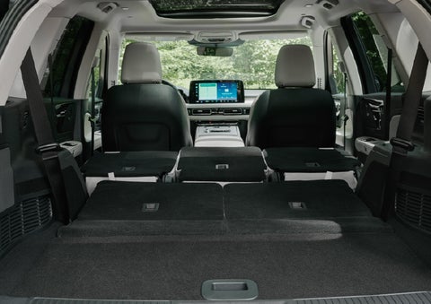 A rear to front view of the interior of a 2027 Lincoln Aviator® Black Label™ SUV shows the third and second rows folded flat | Lexington Park Lincoln in California MD